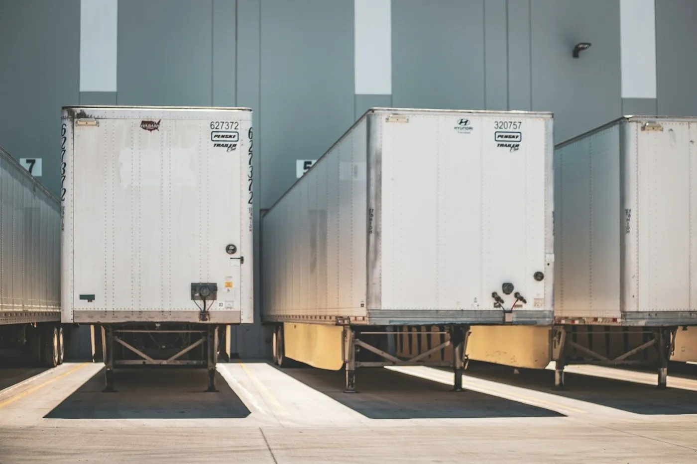 Trailers backed onto a row of dock doors